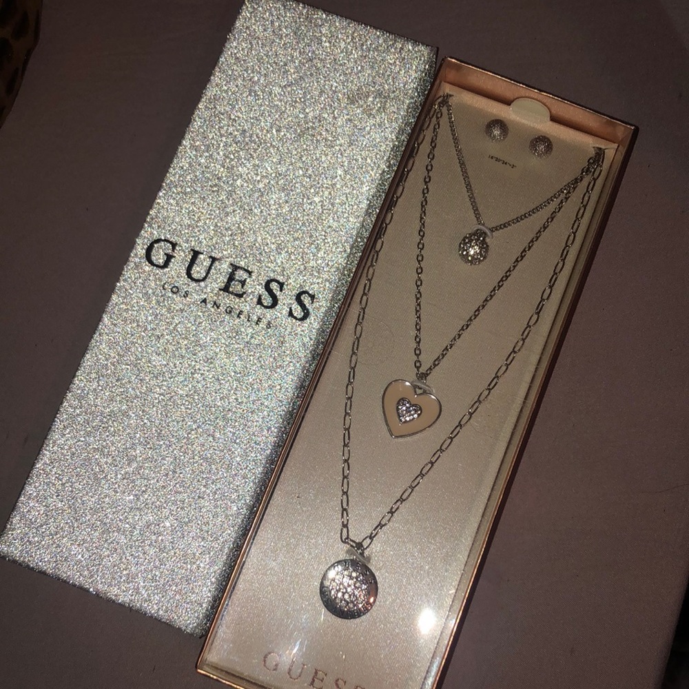 Never Worn Guess Gift Box with 3 Necklaces and 1 pair of Earrings.